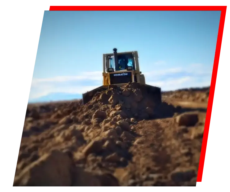 a bulldozer digging a dirt field